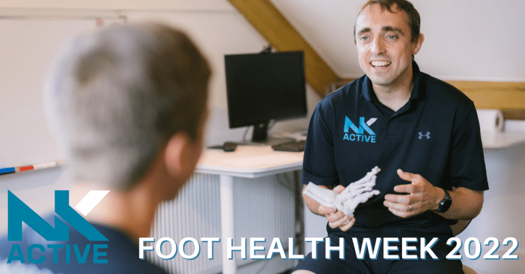 foot health week 2022. Nick from NK Active holding a foot skeleton to demonstrate to a patient