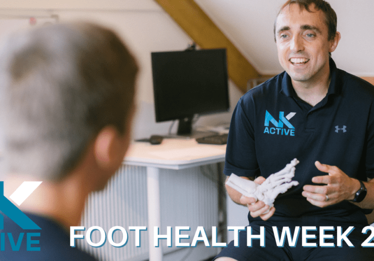 foot health week 2022. Nick from NK Active holding a foot skeleton to demonstrate to a patient